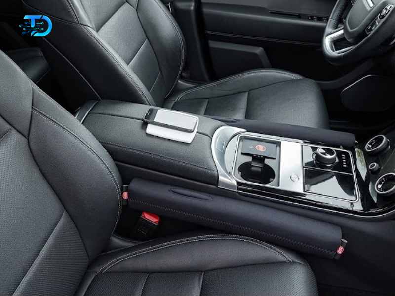 Drop Stop black neoprene car seat gap fillers set of two installed between car seat and center console best seat gap filler 2026