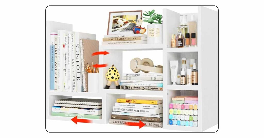 White desktop bookshelf hutch on college dorm desk with two shelves holding small books plant and decorative items beside desk lamp